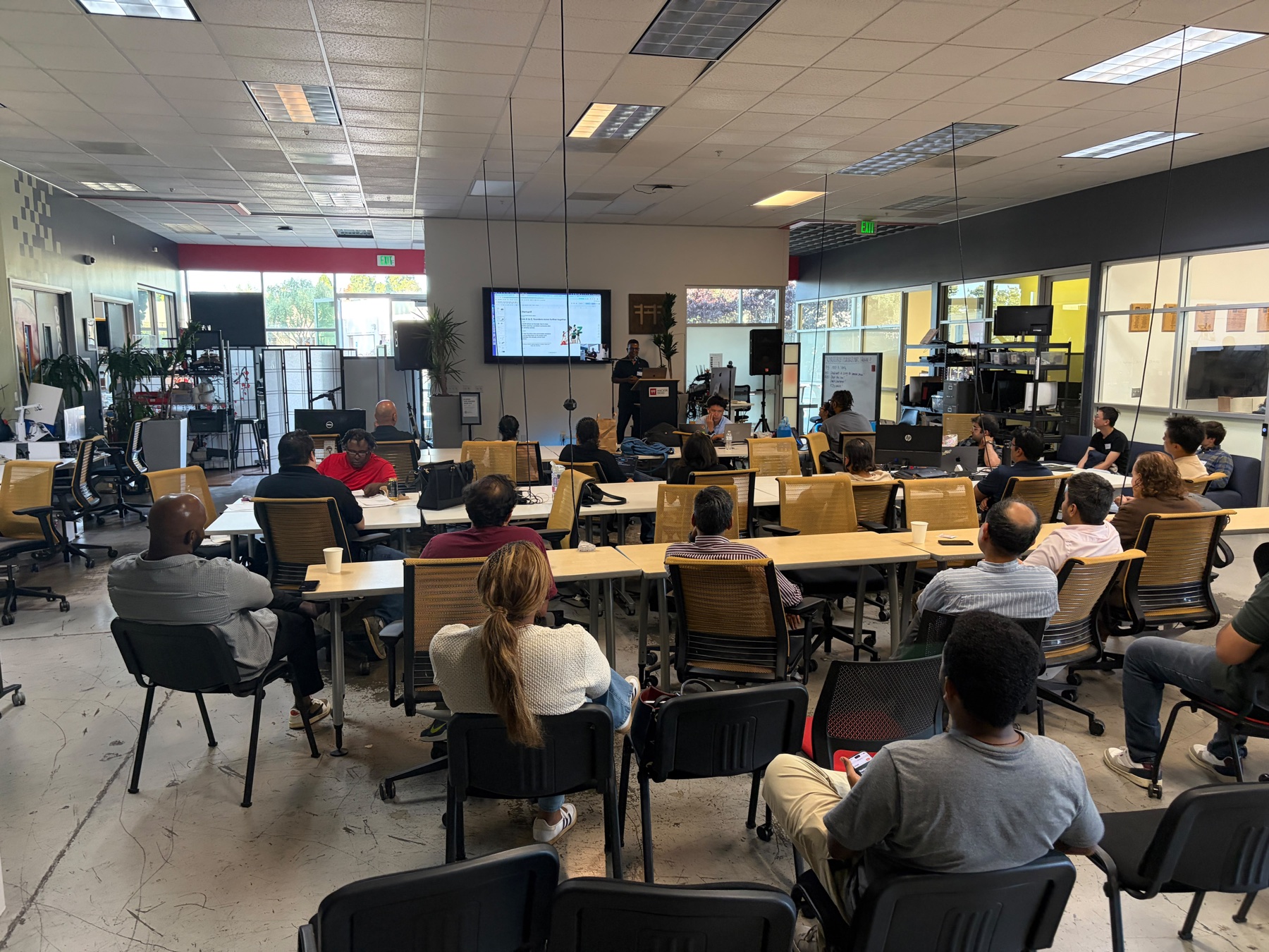 A wide view of the StartupA2Z community listening to a presentation