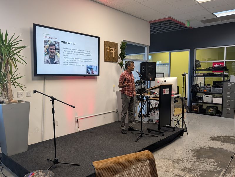 The September 15 masterclass speaker presenting beside an introductory slide at Hacker Dojo